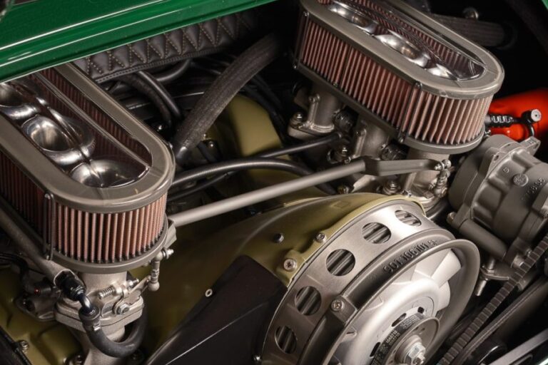 Porsche 911 flat-six engine bay with dual Borla individual throttle body stacks and open-element air filters