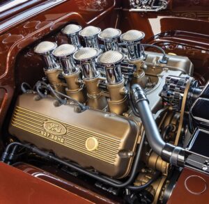 8-stack individual throttle body induction system Ford 427 SOHC engine with 8-stack individual throttle body induction system and mesh air filters in a copper restomod build